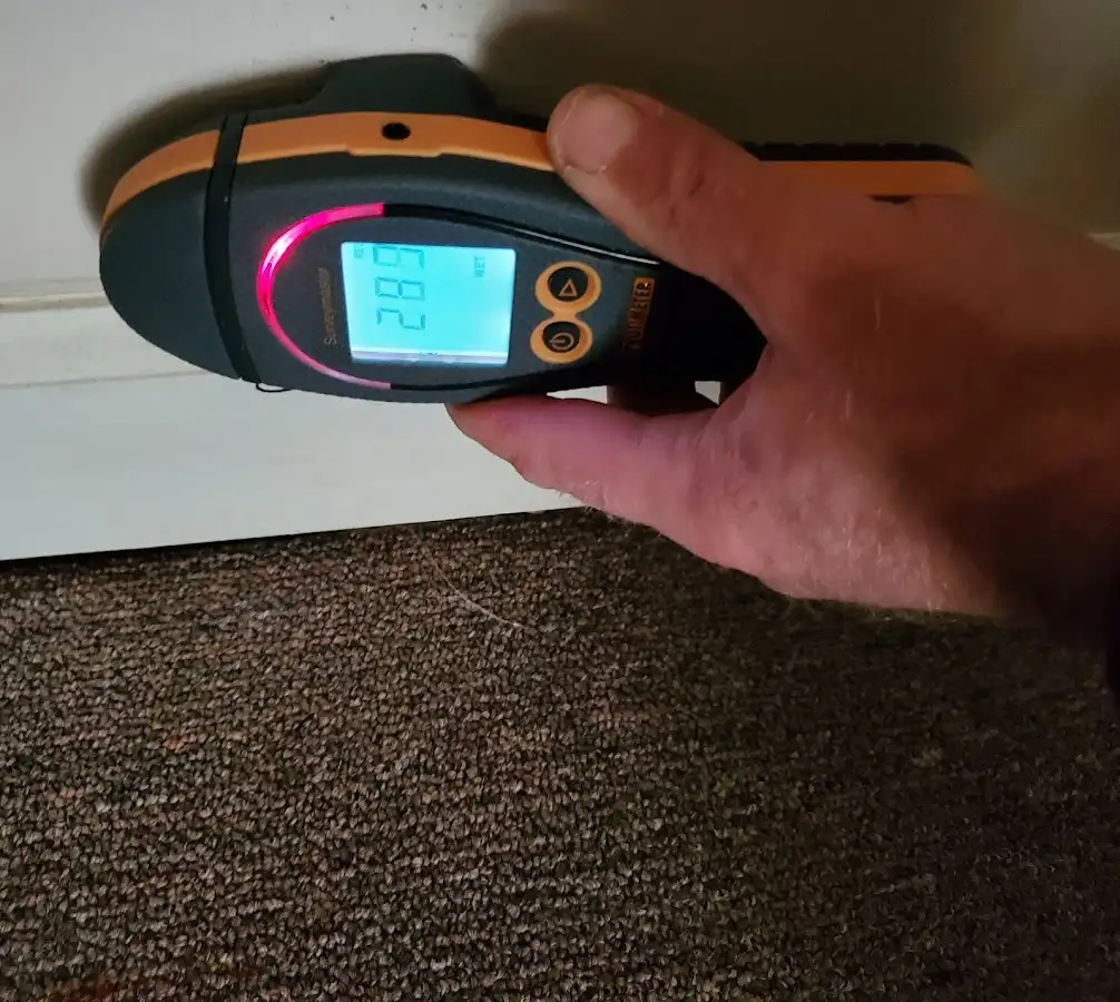 Moisture detection at baseboard during Burst Pipe Cleanup in North Decatur